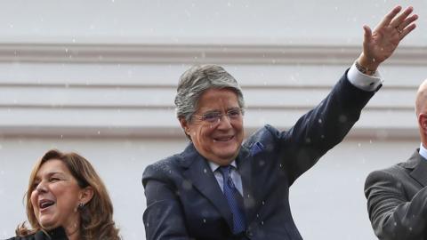 Guillermo Lasso waves at supporters after addressing his impeachment trial