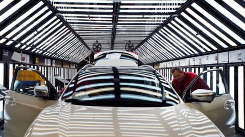 Workers on the production line at Nissan"s factory in Sunderland