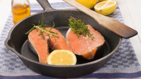 Salmon steaks in frying pan