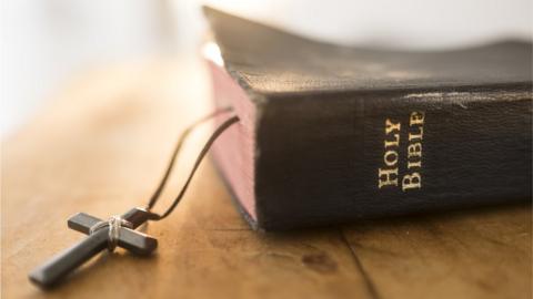 Bible with cross