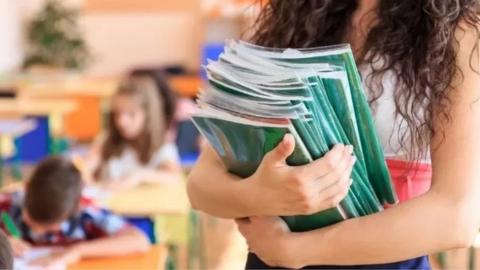 Teacher with books