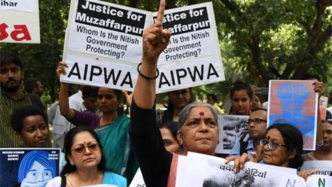 Indian activists hold placards as they take part in a protest over the sexual assault of girls at a state-run home in eastern India city, near Bihar Bhawan in New Delhi on July 30, 2018. Police