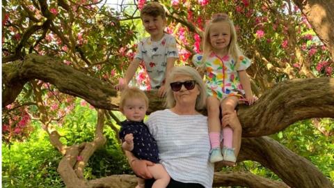 Bridget Davies and her three grandchildren