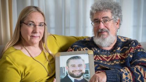 Mary Rich and her husband, Joel Rich hold a photo of their son, Seth Rich, who was murdered in Washington