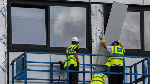 cladding being removed from Whitebeam Court, in Pendleton, Greater Manchester, 2017