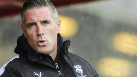 Mark Kennedy in the dugout as Lincoln City boss