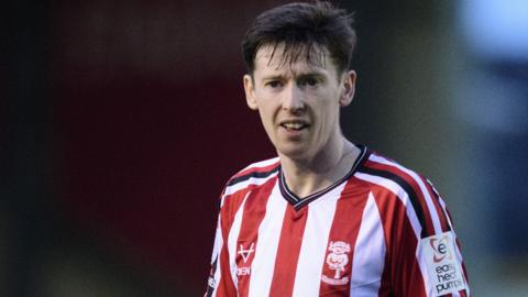 Conor McGrandles playing for Lincoln City