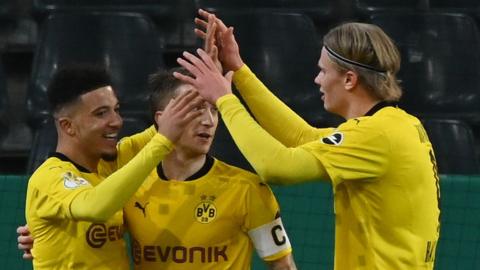 Jadon Sancho celebrates his winner with his Dortmund team-mates