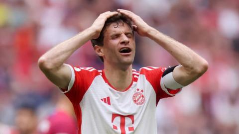 Thomas Muller holds his head in his hands after Bayern Munich are beaten 3-1 at home to Leipzig in the Bundesliga