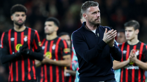 Luton boss Rob Edwards applauds fans after the match at Bournemouth was abandoned due to a medical emergency involving Luton captain Tom Lockyer