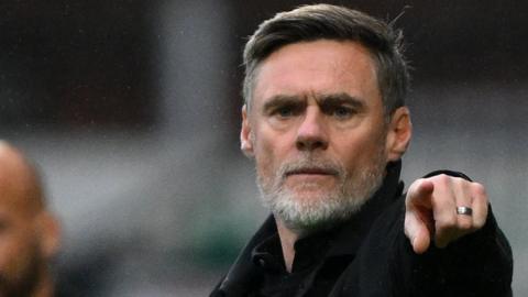 Graham Alexander points for his players on the sidelines