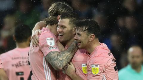 Cardiff celebrate James Collins' goal