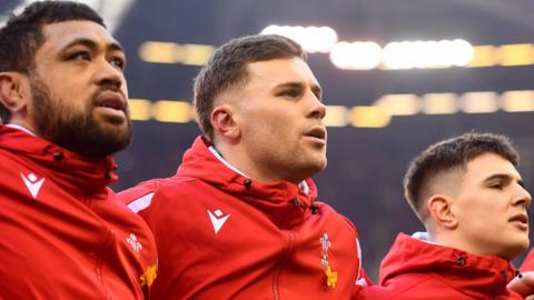 Taulupe Faletau, Mason Grady and Joe Hawkins line up for Hen Wlad fy Nhadau