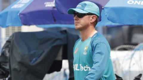 Australia spinner Adam Zampa walks out at training wearing sunglasses