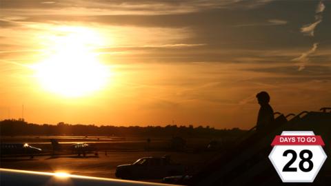 Hillary Clinton steps off a plane as she arrives for a rally in Columbus, Ohio