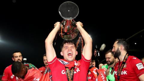 Wrexham's Jordan Davies celebrates the title win