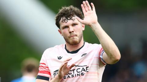 Tom Holmes waves to Reading fans
