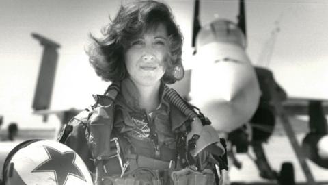 U.S. Navy Lieutenant Tammie Jo Shults, who is currently a Southwest Airlines pilot, poses in front of a Navy F/A-18A in this 1992 photo released in Washington, DC, U.S., April 18, 2018.