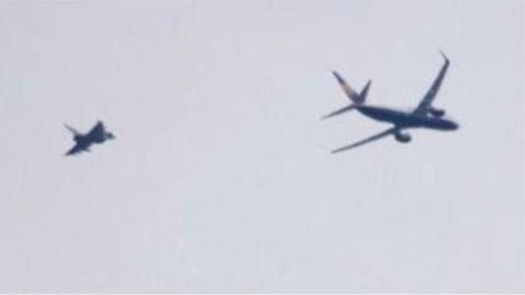 RAF Typhoon jet intercepts a Ryanair passenger plane