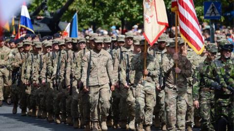 US soldiers march in Warsaw in 2017