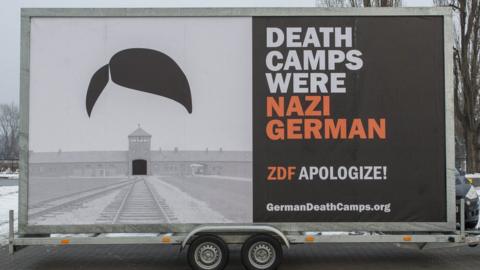 A close-up of the billboard which says: Death camps were Nazi German - ZDF apologise!