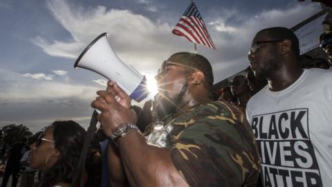 Demonstrators gather after marching at the Louisiana Capitol to protest the shooting of Alton Sterling on July 9, 2016 in Baton Rouge, Louisiana.