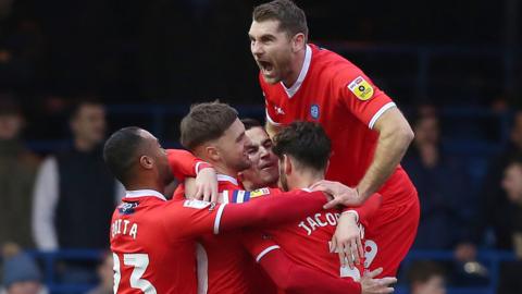 Wycombe celebrate Lewis Wing's opening goal