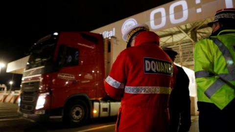 The first trucks leave Eurotunnel's new customs border in Calais just after midnight on 1 January