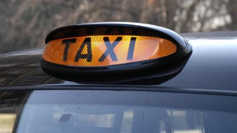 A taxi light on showing a taxi is ready for hire