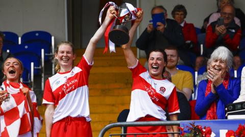 Derry joint captains, Aoife Ní Chaiside and Aine McAllister lift the Jack McGrath Cup
