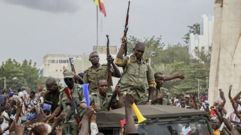 Malians cheer as Mali military enter the streets of Bamako, Mali, 18 August 2020.