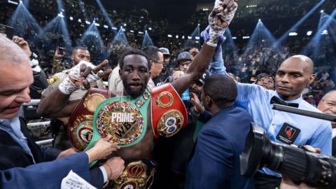 Terence Crawford with all his belts