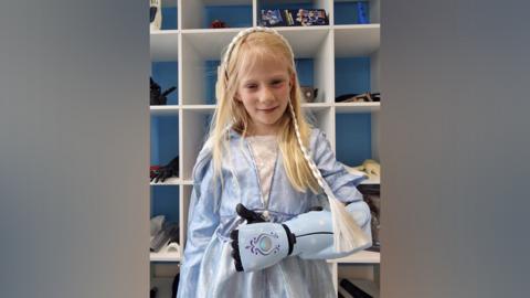 Caitlin wearing her new Frozen themed bionic Hero Arm