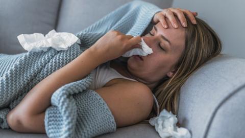 Woman with flu or Covid or a bad cold