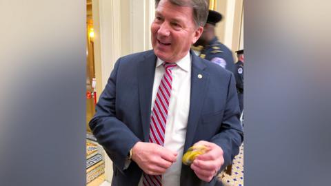 U.S. Senator Mike Rounds (R-SD) plays with a fidget spinner