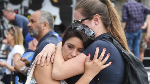 Members of the public observe London Bridge commemoration