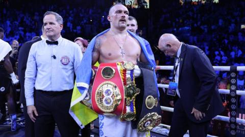 Oleksandr Usyk with his belts