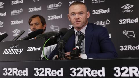 Phillip Cocu and Wayne Rooney