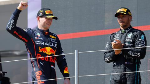 Max Verstappen celebrates on the podium with Lewis Hamilton