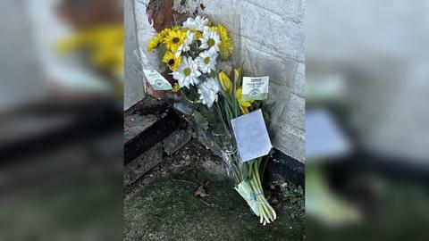 Floral tributes have been left outside the property in Skegness