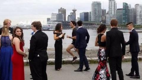 Justin Trudeau's official photographer tweeted a picture of him jogging past students in full prom regalia, captioned: "Prom season in #Vancouver"