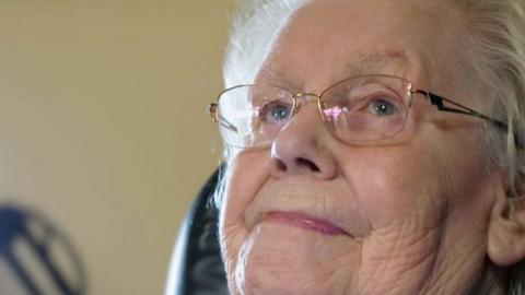95-year-old Elsie Johnston sitting in her livingroom