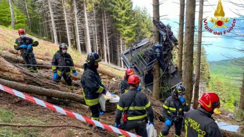 Rescuers at the scene of the accident on Mount Mottarone on 23 May