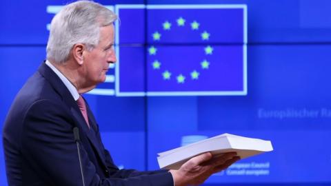 Barnier holding the withdrawal agreement