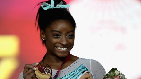 Simone Biles with a gold medal