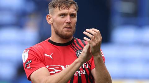 Charlie Wyke applauds the Wigan fans