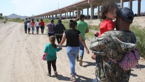 Central American migrants walk into US territory after crossing the Rio Grande under the international bridge in the border city of Ciudad Juarez, in the state of Chihuahua, Mexico, 11 June 2019. Foreign Minister Marcelo Ebrard said that the Mexican government will achieve a reduction in the flow immigration demanded by the U