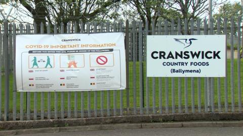 A Covid-19 warning sign outside the Cranswick Country Foods plant