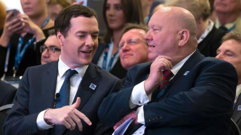 George Osborne (L) speaks to Liverpools' mayor Joe Anderson