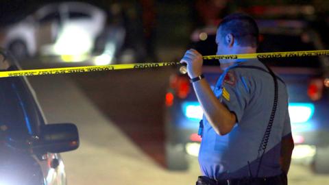 Police officers work in the Hedingham residential neighbourhood during an active shooter situation in Raleigh, North Carolina